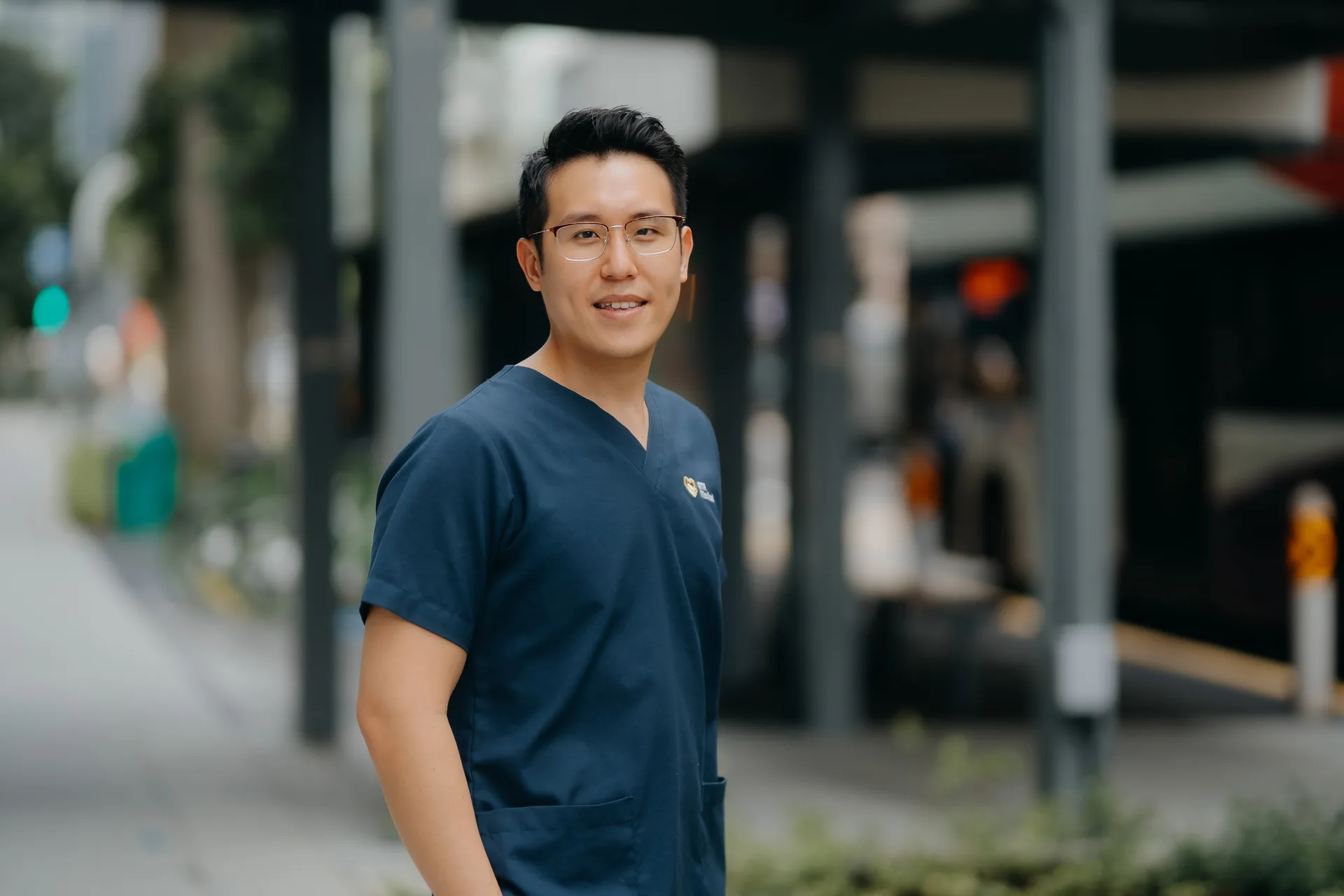 Dr Joel Foo, men&rsquo;s health doctor in Singapore, standing in a clinic consultation room